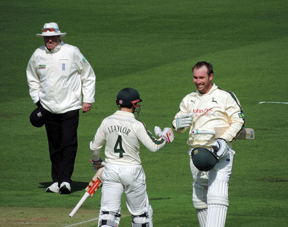 James Taylor congratulating Brendon Taylor after he'd reached 100 for Notts